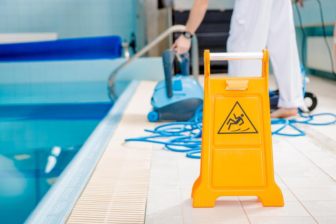 pool cleaning slippery sign